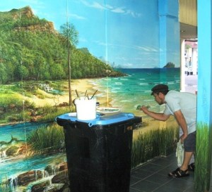 Artists painting a wall